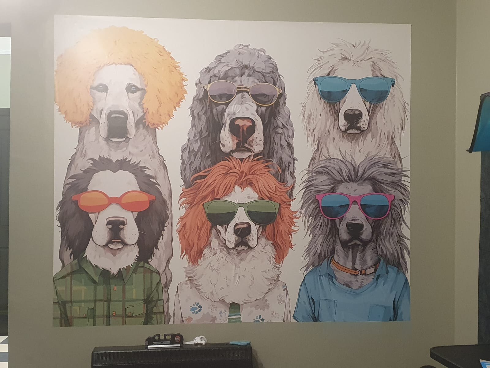 The salon's wall mural: six cartoon dogs in wigs, sunglasses and shirts